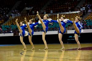 Photo by: Chancey Bush Clear Creek pom squad dancer Renee Barnes leaps into the air during the 2A state spirit championships at the Denver Coliseum on Dec. 6.